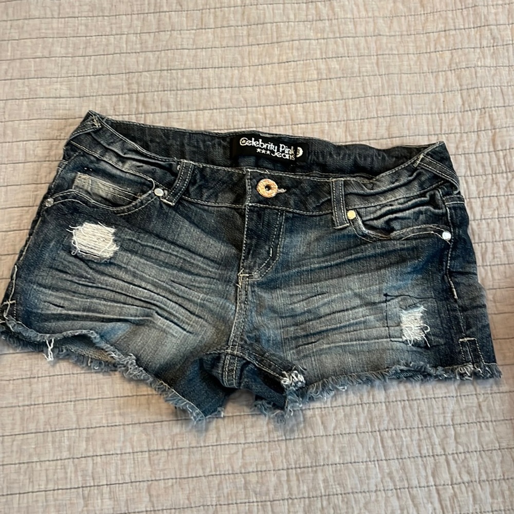 Low rise celebrity pink jeans, wiskered, frayed hem, glitter accents